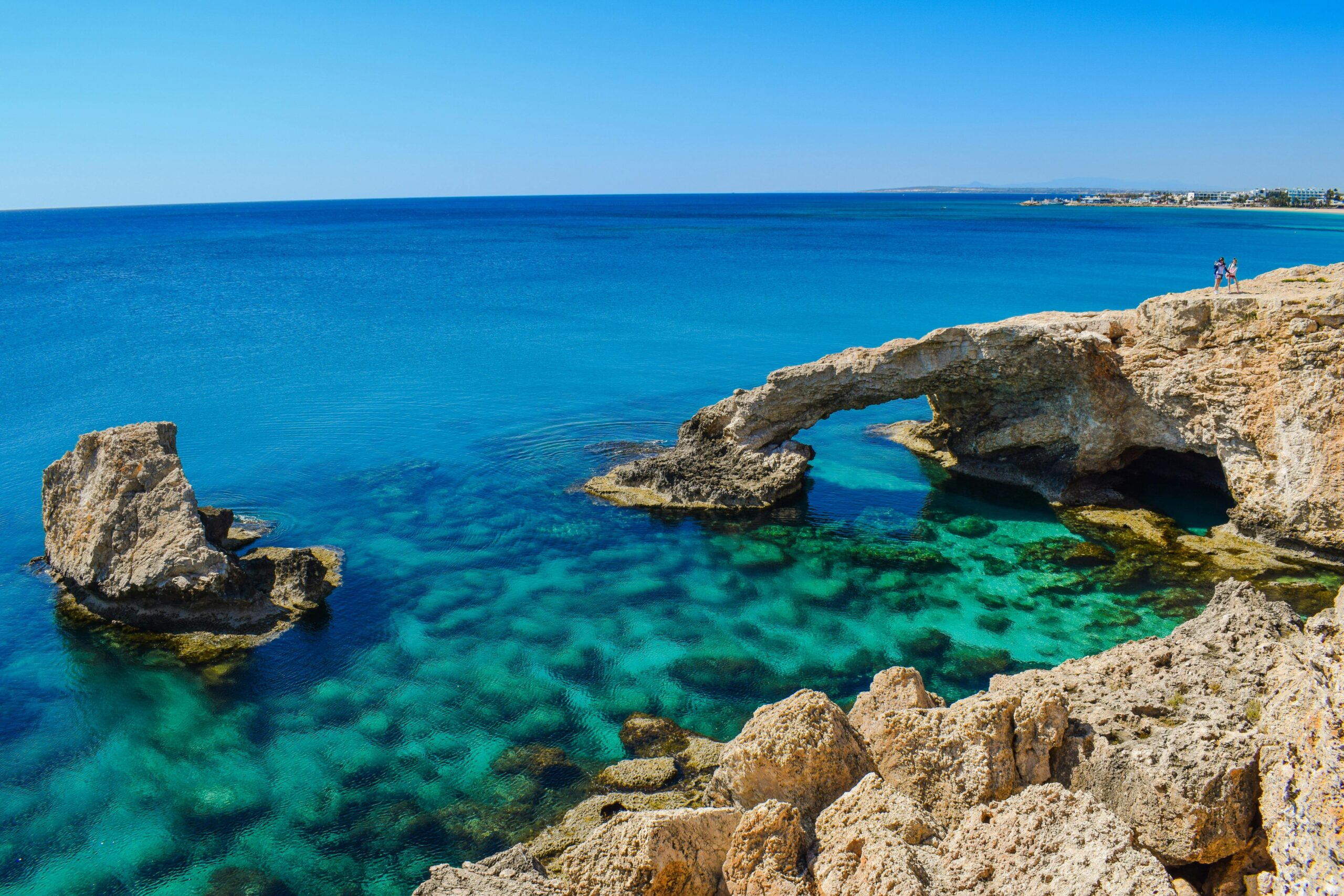 Scenic coastal rock formation and clear blue waters in Cyprus