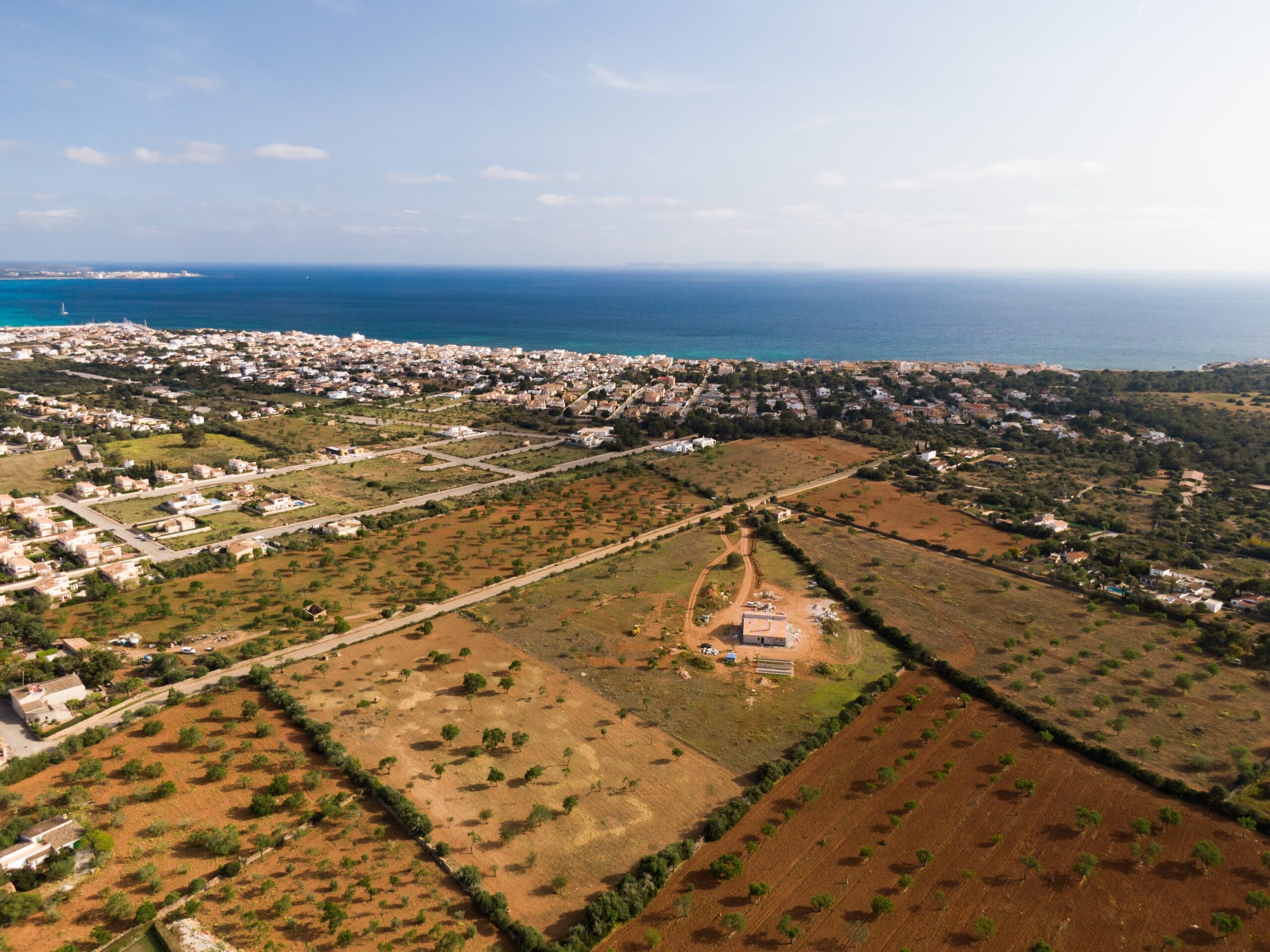 Aerial view of real estate development and farmland near the coast in Cyprus