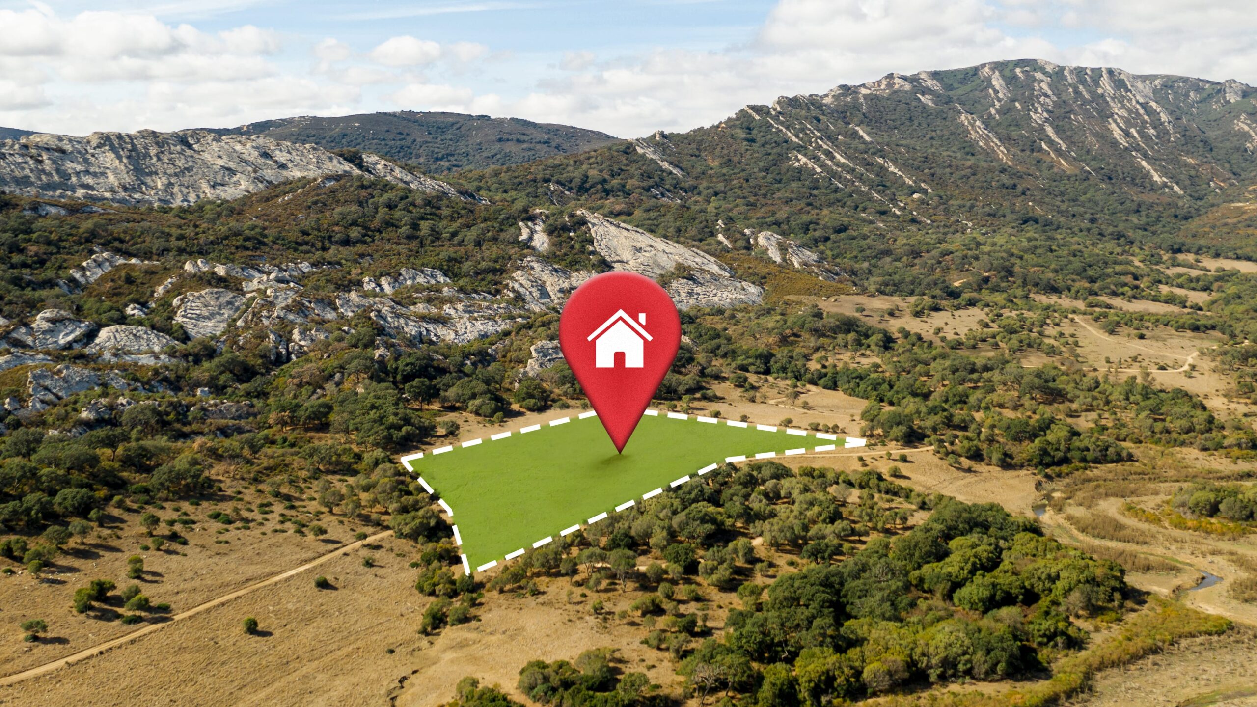 Highlighted plot of land for sale in a mountainous area with a location pin icon.