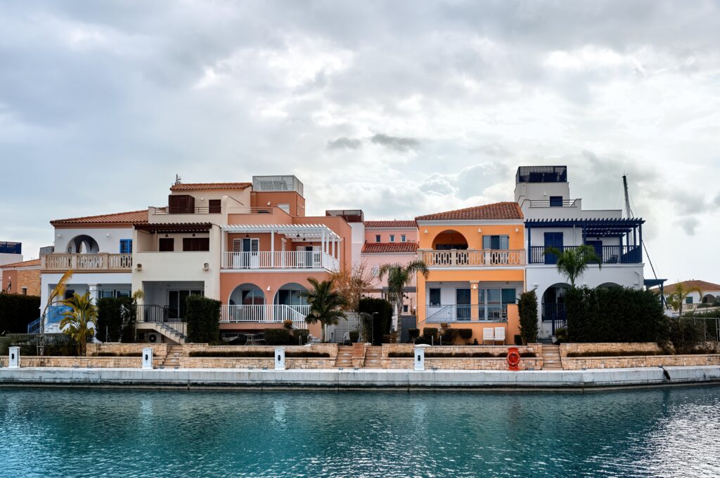 Waterfront luxury villas in Cyprus with Mediterranean architecture and private docks.