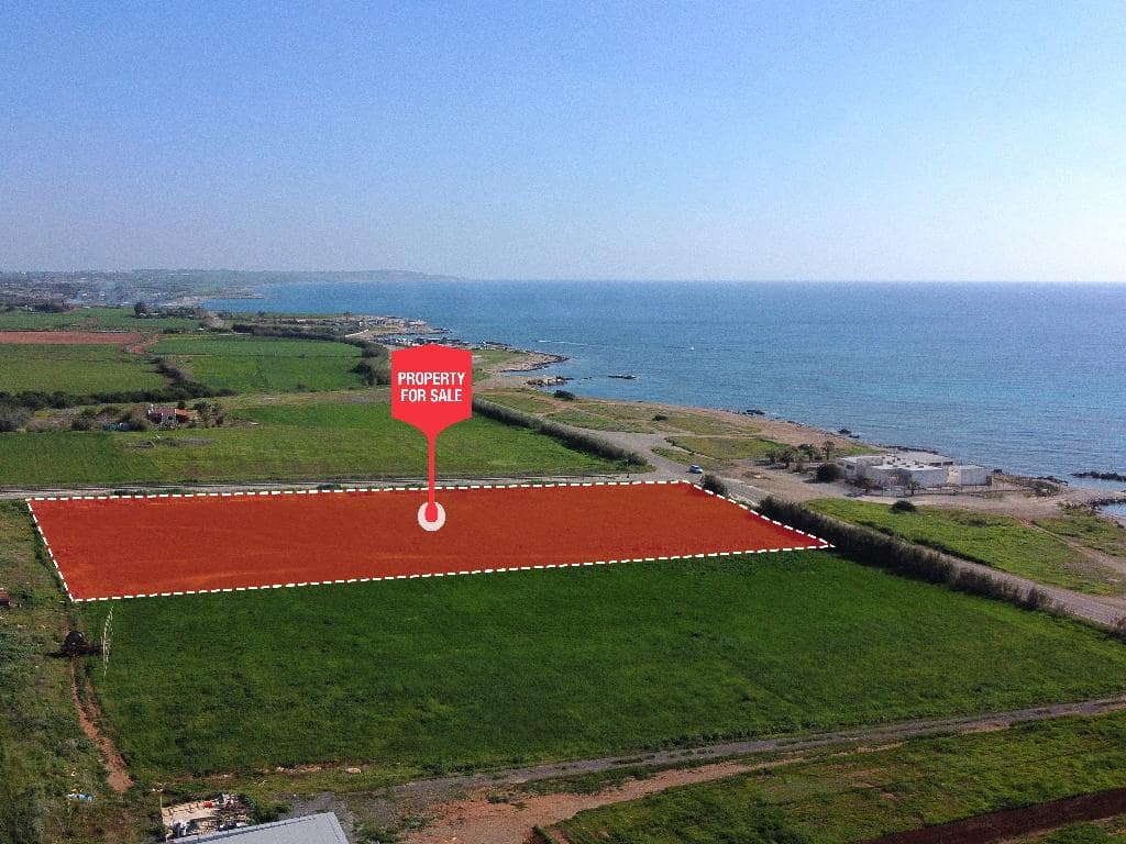 Coastal plot of land for sale in Larnaca, Cyprus, highlighted in red near the Mediterranean Sea.