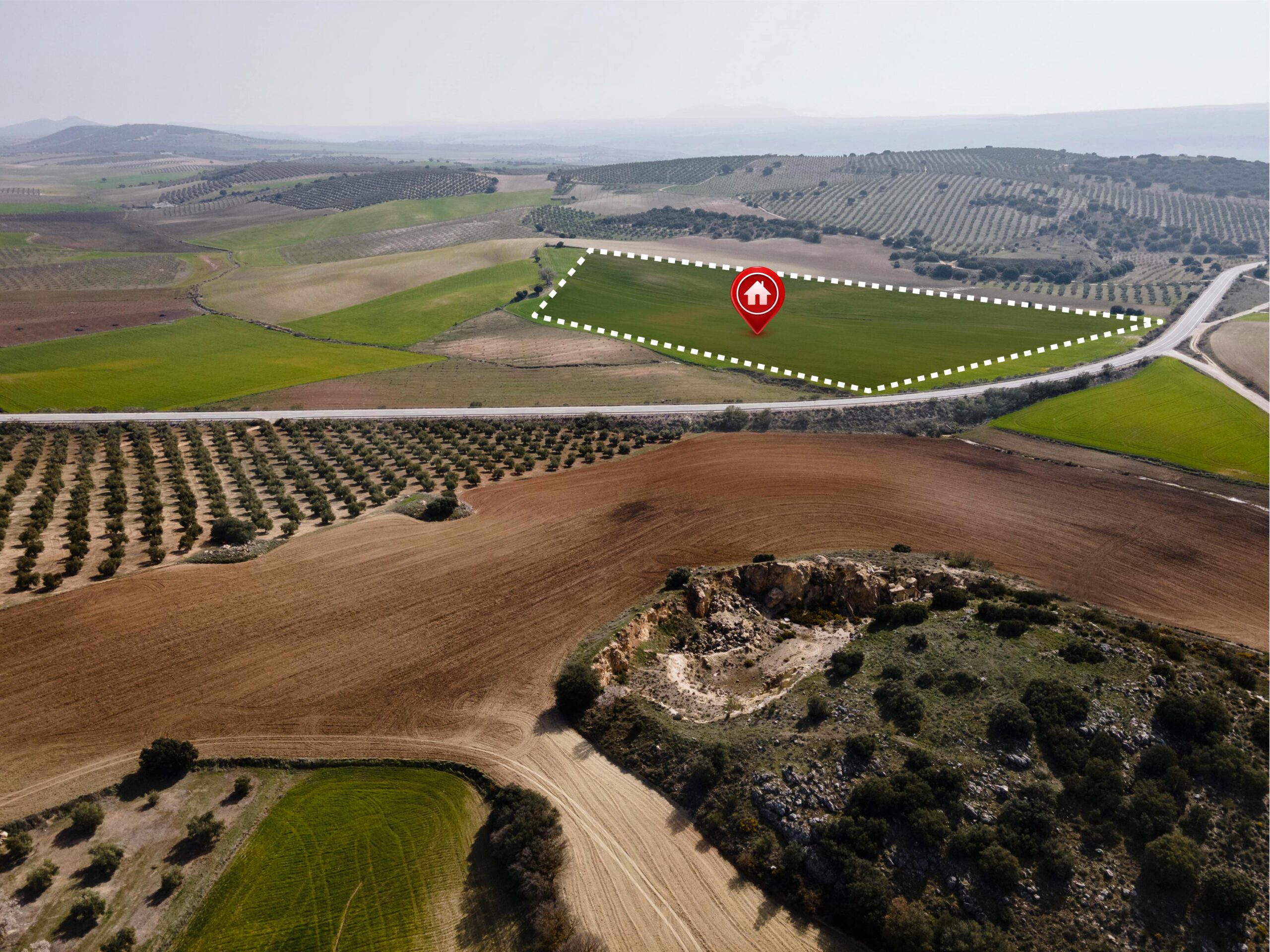 Aerial view of agricultural land for sale in the Larnaca property market, marked with a home location pin and white boundary.