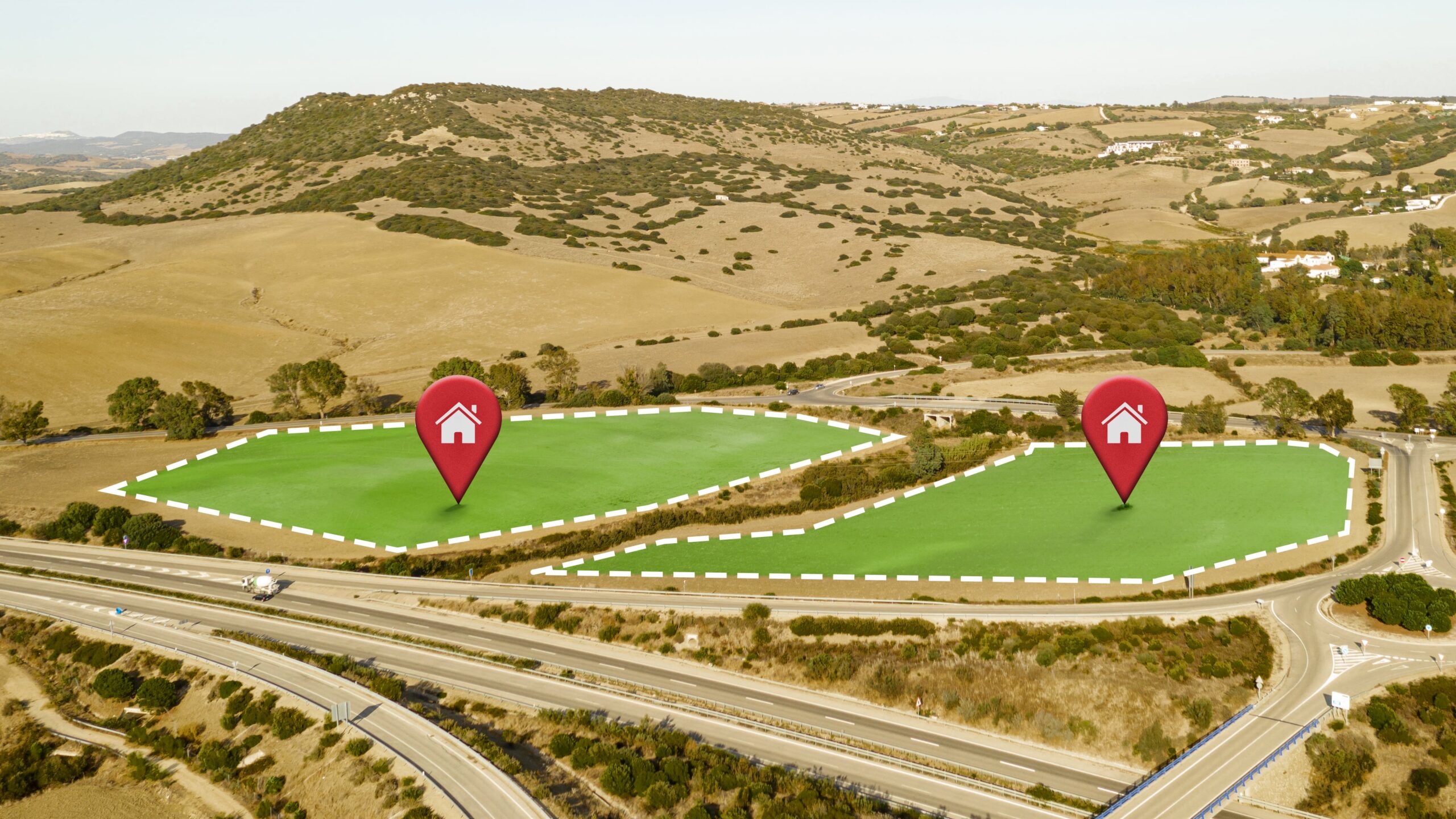 Aerial view of two highlighted plots of land for sale near a highway in the Larnaca property market.
