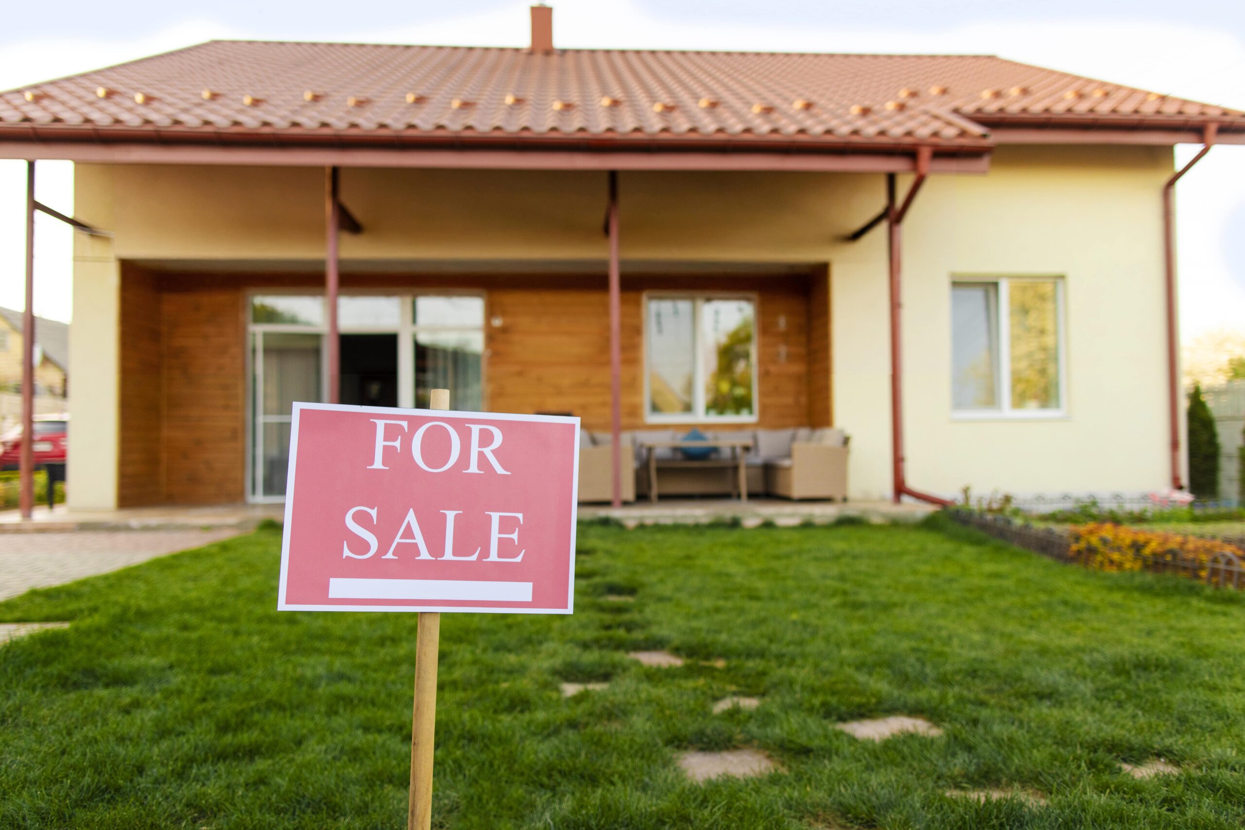 Larnaca home with a "For Sale" sign on the lawn