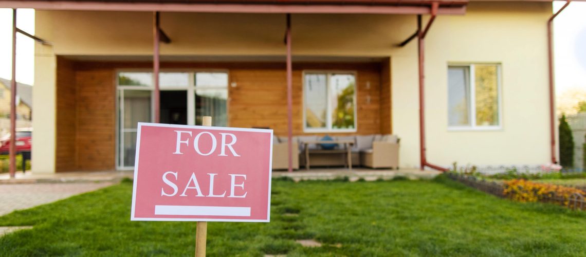 Larnaca home with a "For Sale" sign on the lawn