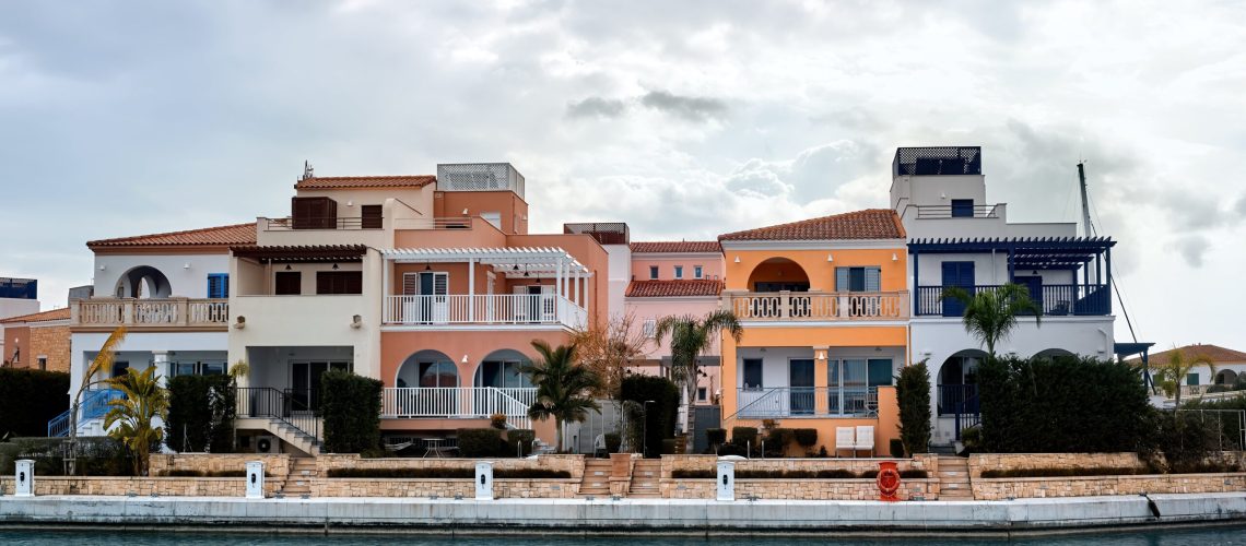 Waterfront luxury villas in Cyprus with Mediterranean architecture and private docks.
