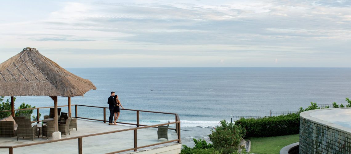Luxury oceanfront real estate in Cyprus with a thatched roof gazebo and scenic sea views"